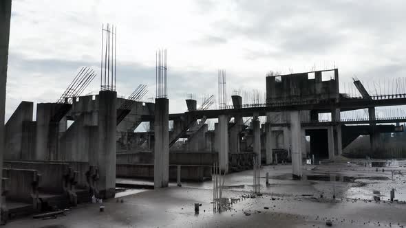 Concrete columns, girders and beams reinforced with steel bars on abandoned construction site