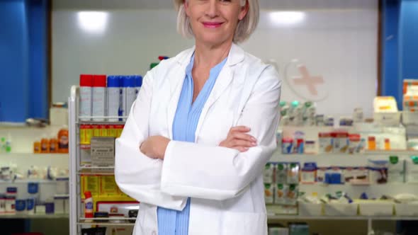 Pharmacist standing at counter in pharmacy