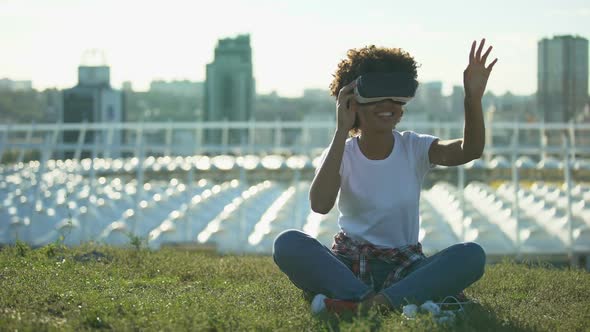 Funny Curly Haired Female Using VR Headset