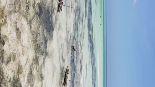 Vertical Video of Low Tide in the Ocean Near the Coast of Zanzibar Tanzania Aerial View