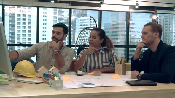 Creative Business People Group Having Conversation at Office Desk in Workplace