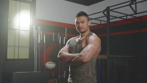 Asian attractive Active Fitness sportman trainer  exercise to maintain muscle and biceps for health.