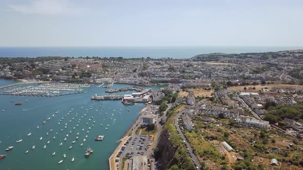 Aerial view of busy harbour in Brixham England. English harbour filled with boats.