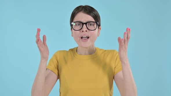 Young Woman Showing Annoyance Through Hand Gesture on Purple Background 