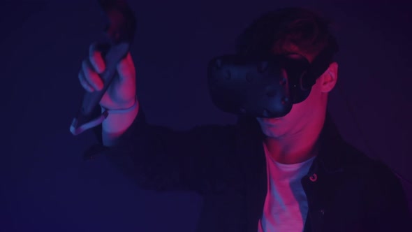 Close Up of Attractive Man in Virtual Reality Glasses Draws Abstract Lines and Figures Using