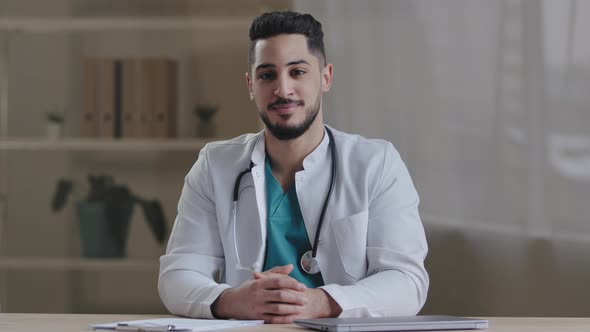 Happy Smiling Millennial Hispanic Nurse Doctor Therapist Cardiologist Practitioner Intern Wear White