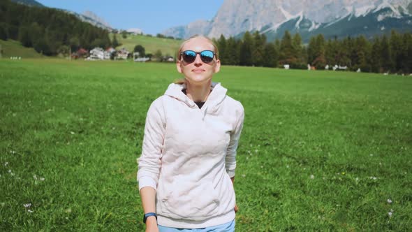 Blonde Woman Having Fun By Running in Nature Field in Summer