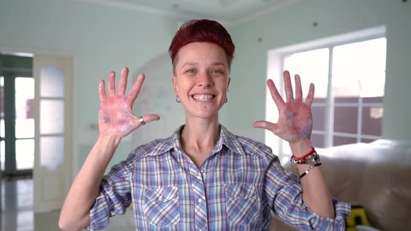 Medium Shot of Joyful Woman Grimacing Gesturing Showing Thumbs Up Looking at Camera