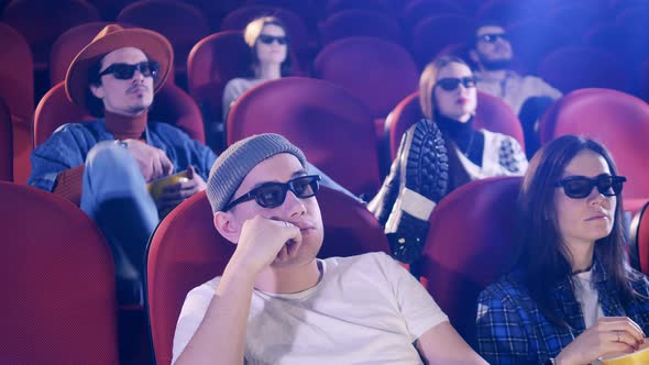 People are Throwing Popcorn at Each Other in the Cinema