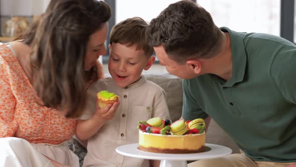 Happy Family with Birthday Cake at Home Party