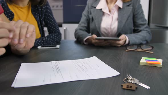 Male Hands Signing Home Purchase Contract