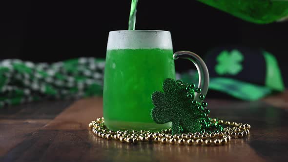 Pouring green beer into a frosty mug on St Patricks Day