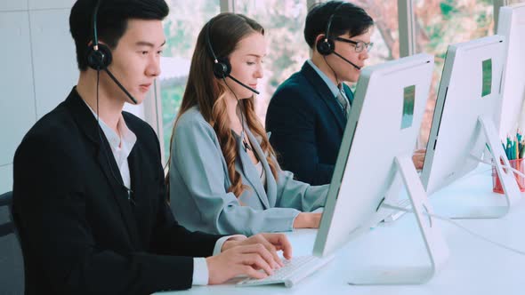 Business People Wearing Headset Working in Office