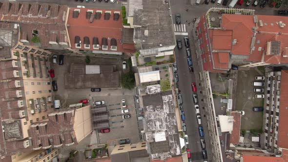 Narrow streets and private apartment building yards in Turin, aerial top down view