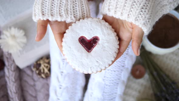 Softness, Comfort, Holiday, Feast, Coziness Concept. Cookie With Heart In Hands.