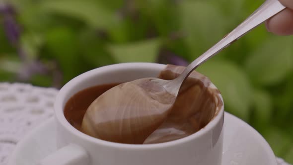 Hot Chocolate Cup on Table at Cafe Outdoors Summer