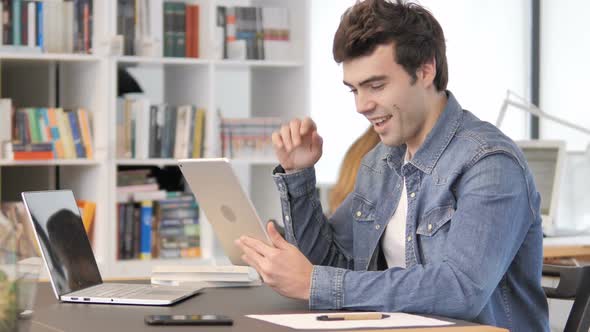 Creative Man Doing Online Video Chat on Tablet