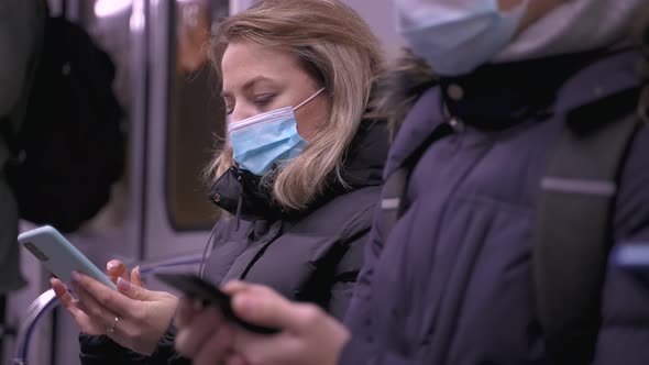 Urban People Using Phones During Ride in Metro