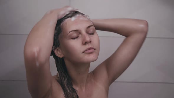 Woman Washes Head Under Shower