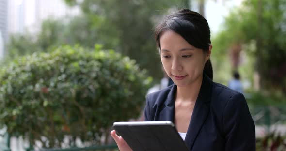 Young Businesswoman work on tablet computer at Hong Kong city