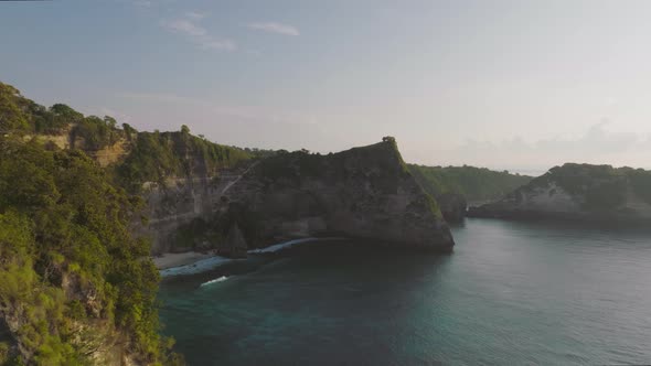 Revealing diamond beach on tropical Nusa Penida island during scenic sunrise, aerial