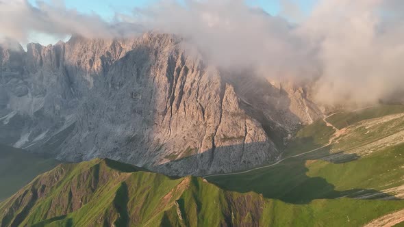 Sunrise in the Dolomites mountains with fog and mist