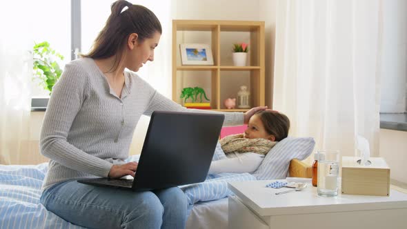 Ill Daughter and Mother with Laptop at Home