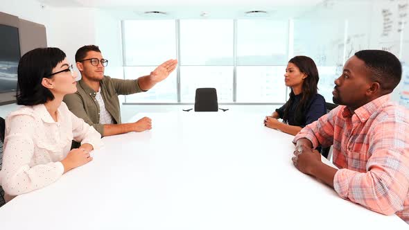 Business colleagues using invisible screen in conference room 4k