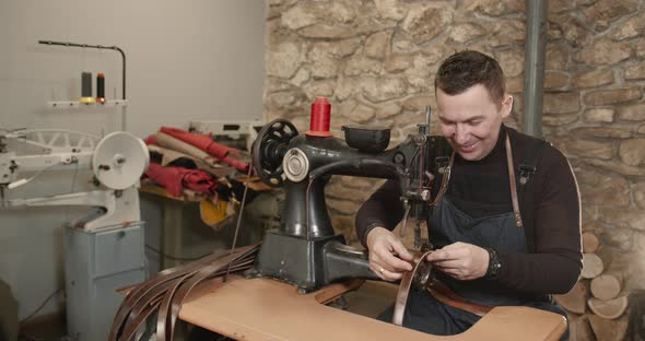 Craftsman Working with Leather in a Workshop