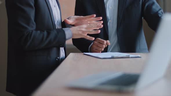 Closeup of Male Hands Gesturing Discussing Project Unrecognizable Two Colleagues Multiethnic