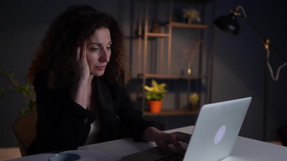 Tired Business Woman in the Office Put Her Head on the Table