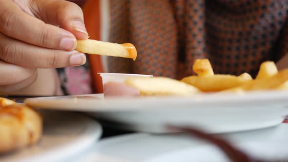 Eating French Fries on Plate