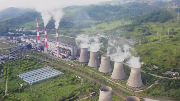 Aerial View of the Pipes of a Coal Power Plant and Cooling Tower