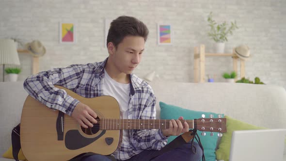 Portrait Young Asian Man Musician Plays the Guitar