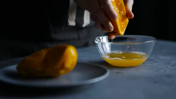 Woman Squeezing Fresh Orange Juice