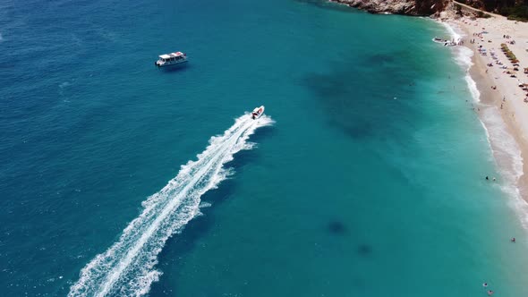 Drone View of a Boat the Blue Clear Waters