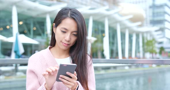 Woman working on mobile phone