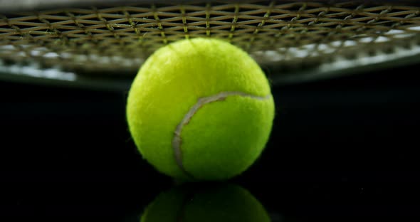 Tennis ball and racket in studio 4k