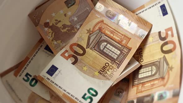 Laundering money concept. Euro money banknotes in washing machine , illegal cash 50 euro, tax 