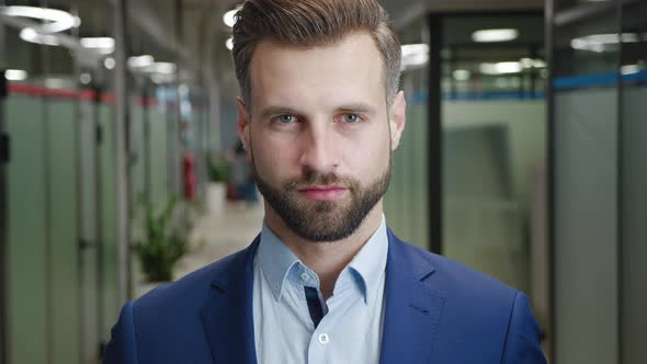 Close Up of Serious Male Boss with Beard Looking to Camera