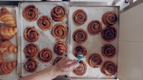 Baker Greases Freshly Baked Escargot Buns and Classic Croissants with Ghee