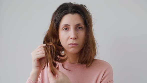 Woman with Hair Problems Depressed and Worried