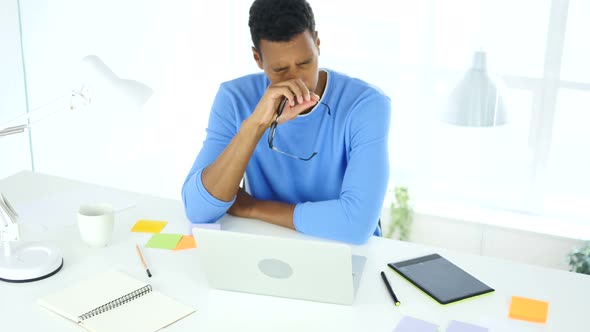 Afro-American Creative Designer Sleeping in His Office