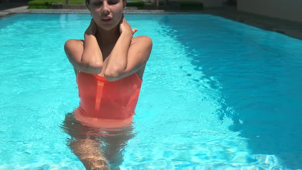 Woman Is Going Out From Water of Pool