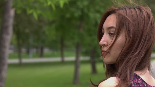 Portrait of girl in park.