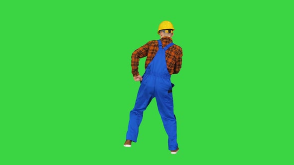 Construction Worker in Helmet Dancing on a Green Screen, Chroma Key