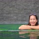 Young asian woman enjoy around outdoor swimming pool for leisure - VideoHive Item for Sale