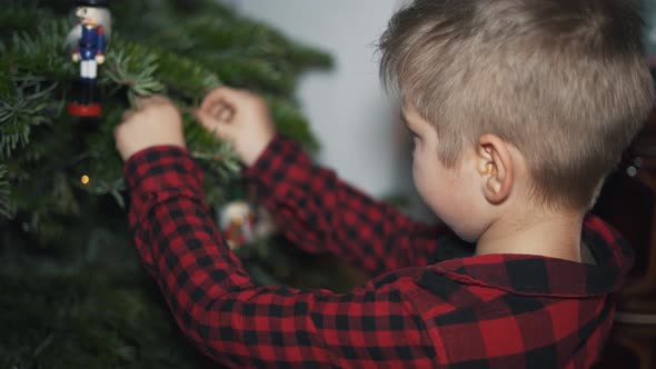 Boy Decorated Christmas Tree