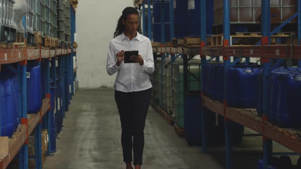 Young female manager worker in a warehouse