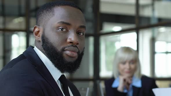 Afro-American Male Employee Looking on Camera, Racial Equality in Workplace